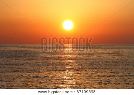 Golden sunset with reflection on the sea