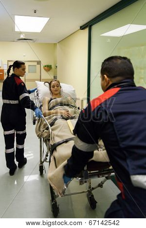 paramedics taking patient to hospital casualty