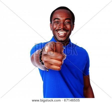 Laughing african man pointing at you over white background