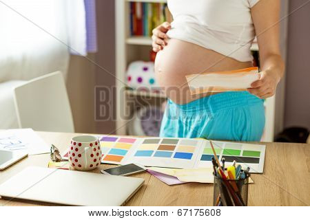 Pregnant woman working from home
