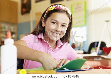 Pre teen girl in art and craft class