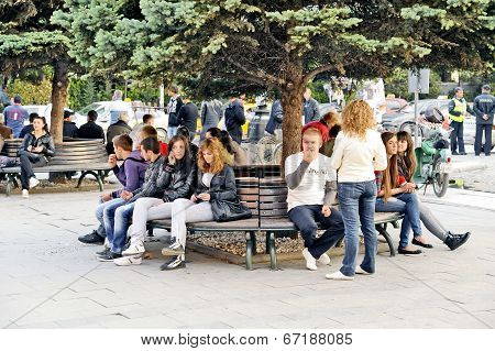 People sitting on a park bench in Bitola