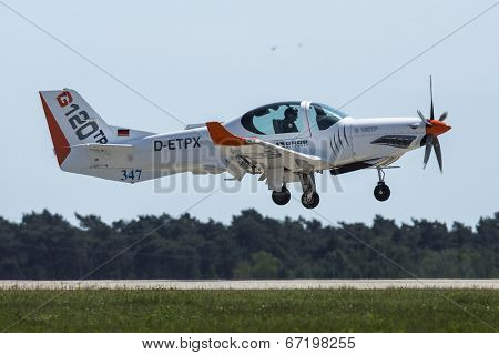 BERLIN, GERMANY - MAY 20, 2014: Two seated training and aerobatic low-wing aircraft Grob G120 TR (Germany), demonstration during the International Aerospace Exhibition ILA Berlin Air Show.