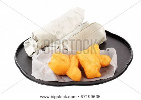 Deep Fried Dough Stick And Roti Flat Bread In Paper Wrap