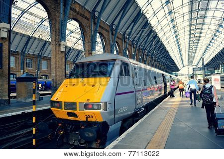 LONDON, UK - SEP 27: Kings Cross station with train on September 27, 2013 in London, UK. Opened in 1852, it is the southern terminus of the East Coast Main Line.