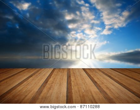 Stunning Landscape At Sunset Reflected In Ocean With Wooden Planks Floor