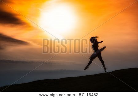 Ballerina Silhouette, Dancing Alone In Nature In The Mountains At Sunset