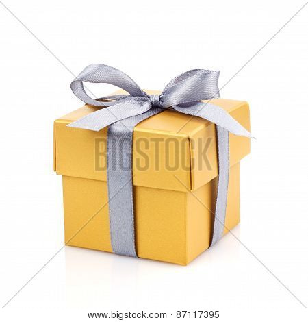 golden gift box with silwer ribbon