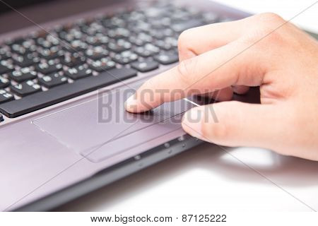 Hands Typing On A Laptop Trackpad