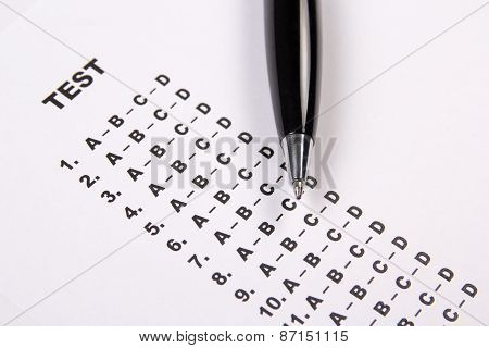Close Up Of Test Score Sheet With Answers And Pen