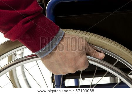 Wheelchair user makes various movements with his wheelchair, exercises for safety handling