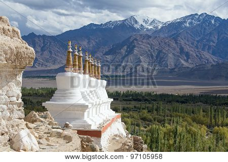 Buddhist Chortens (stupa) And Himalayas Mountains In The Background Near Shey Palace In Ladakh, Indi