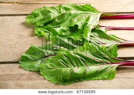 Fresh swiss chard on wooden table, close up
