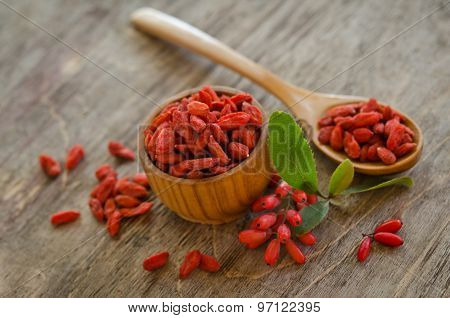 Barberries And Goji Berries On Wooden Background