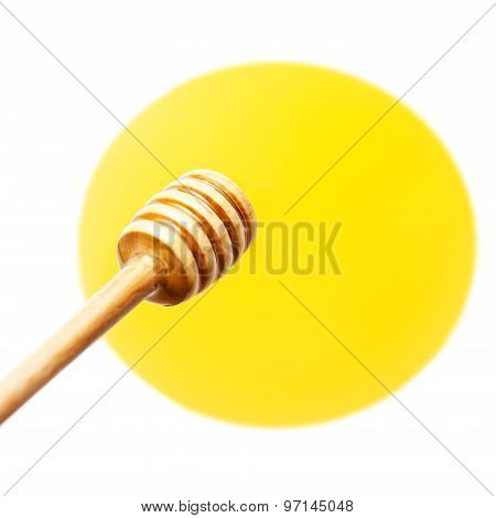 Wooden Honey Dipper With Yellow Honey Flowing Drops Isolated On White Background Macro.