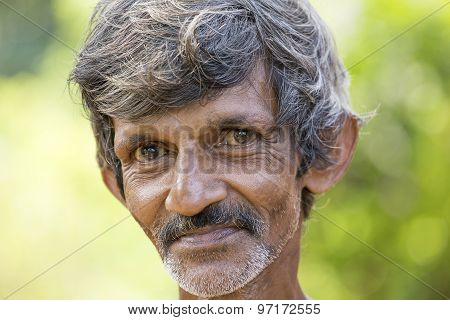 Portrait poor Sri Lankan man on a street in Matara