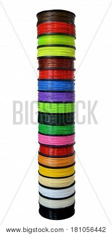 Filament wire for 3D printer close-up. Reels of filament wire for 3D printer different colors. Material produced from FDM printing technology. Many reels vertical view. Isolated on white background