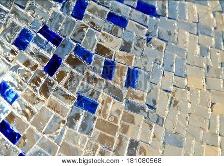 Detail of a beautiful crumbling abstract glass mosaic decoration. Stained-glass window. Leaded pane or panel. Glass painting. Decorative background. Selective focus. Closeup macro view. Horizontal.
