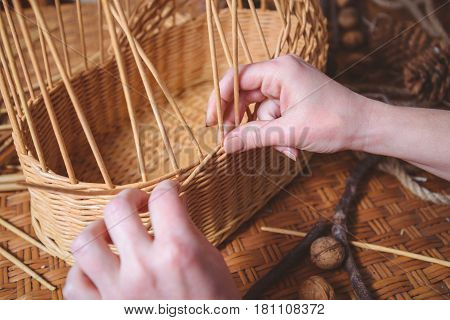 pretty woman making basktes indoor, handmade business