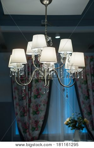 decorative designer chandelier on a dark background.