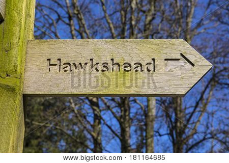 A sign pointing towards the direction of Hawkshead in the Lake District in Cumbria UK.