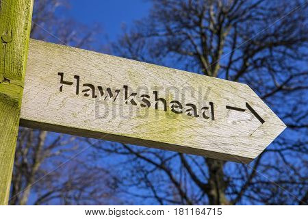 A sign pointing towards the direction of Hawkshead in the Lake District in Cumbria UK.