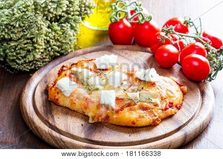 Pizza With Artichoke And Oregan On Wood