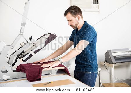 Man Using A Serigraph Press