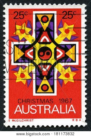 AUSTRALIA - CIRCA 1967: A used postage stamp from Australia depicting a biblical cross commemorating Christmas circa 1967.