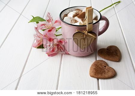 romantic background mug of chocolate with marshmallows