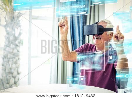 Digital composite of Old man happy wearing VR Virtual Reality Headset with Interface