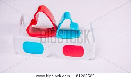 3d glasses with red and blue hearts represent love for cinema.