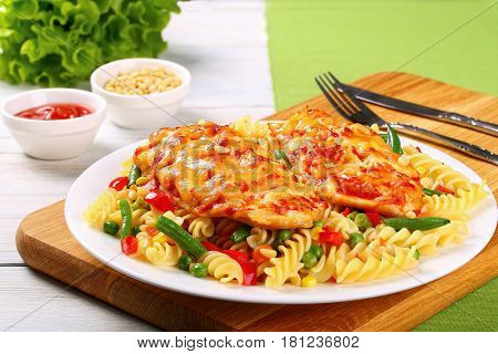 Grilled Chicken Breasts And Pasta On Plate