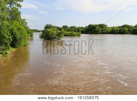 The Arkansas River near Mulvane Kansas with high water due to heavy rain.