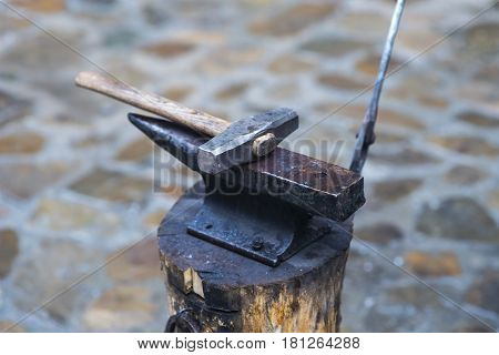 Metal fabricator utilizing a torch to heat up a piece of metal in order to shape it utilizing a forging technique developed over hundred years ago.