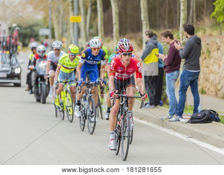Barcelona Spain - March27 2016: The peloton riding during Volta Ciclista a Catalunya on the road to the top of Montjuic in Bracelona Spain on March 27 2016.