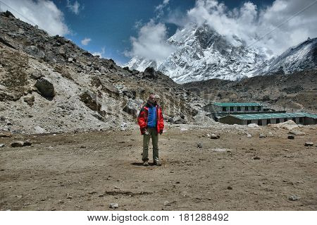 Man in the background of the village of Kala Patar in Nepal