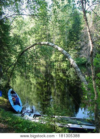 Kayak dry on the river bank after a hike.