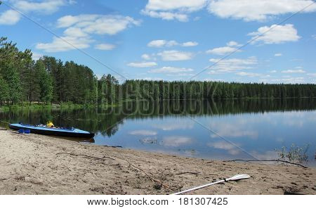 Kayak dry on the river bank after a hike.