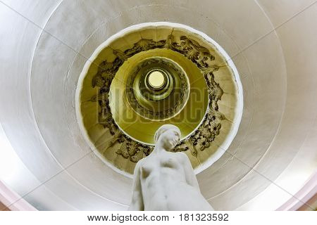Havana, Cuba - Jan 14, 2017: Ornate circular staircase and lobby in an art deco apartment building in the Vedado neighborhood of Havana Cuba.
