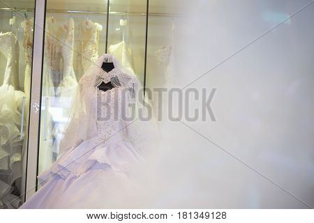 white wedding dress gown on mannequin in bridal gown. Bride's morning wedding preparation concept