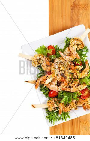 Grilled Shrimp Skewers Appetizer Salad Isolated on White background. Selective focus.