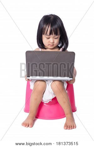 Asian Chinese Little Girl Sitting On Chamberpot With Laptop
