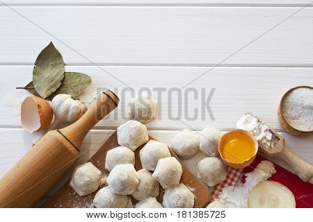 cook a delicious ravioli on a wooden table