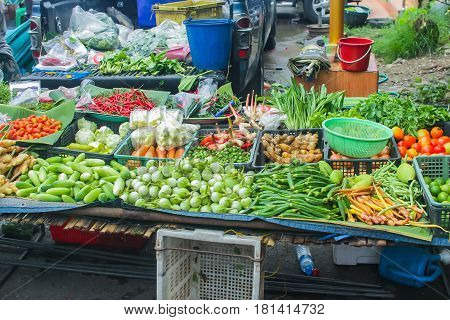 unclean vegetable sale food stall in upcountry rural street market in Asia.