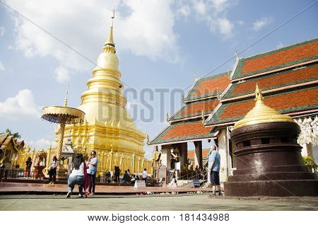 Asian Thai People And Foriegner People Respect Praying And Walk Visit Gold Chedi At Wat Phra That Ha