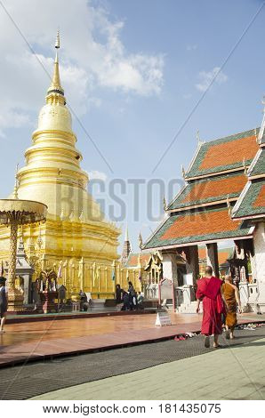 Asian Thai People And Foriegner People Respect Praying And Walk Visit Gold Chedi At Wat Phra That Ha