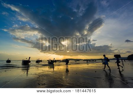 Ao Nang Krabi Thailand - March 02 2017: People on the Ao Nang beach at sunset in Krabi province Thailand