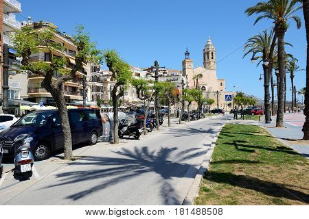 SITGES SPAIN - MAY 23: The tourists enjoiying their vacation at seafront on May 23 2015 in Sitges Spain. Up to 60 mln tourists is expected to visit Spain in year 2015.