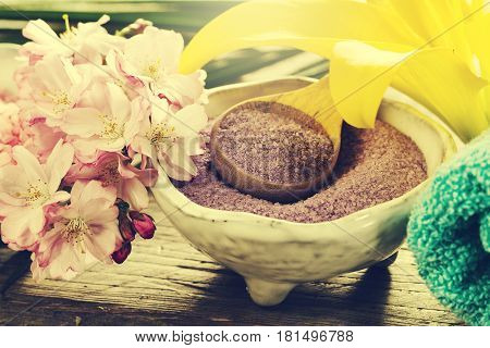 Spa Concept. Closeup of beautiful Spa Products - Spa Salt and Flowers. Horizontal.